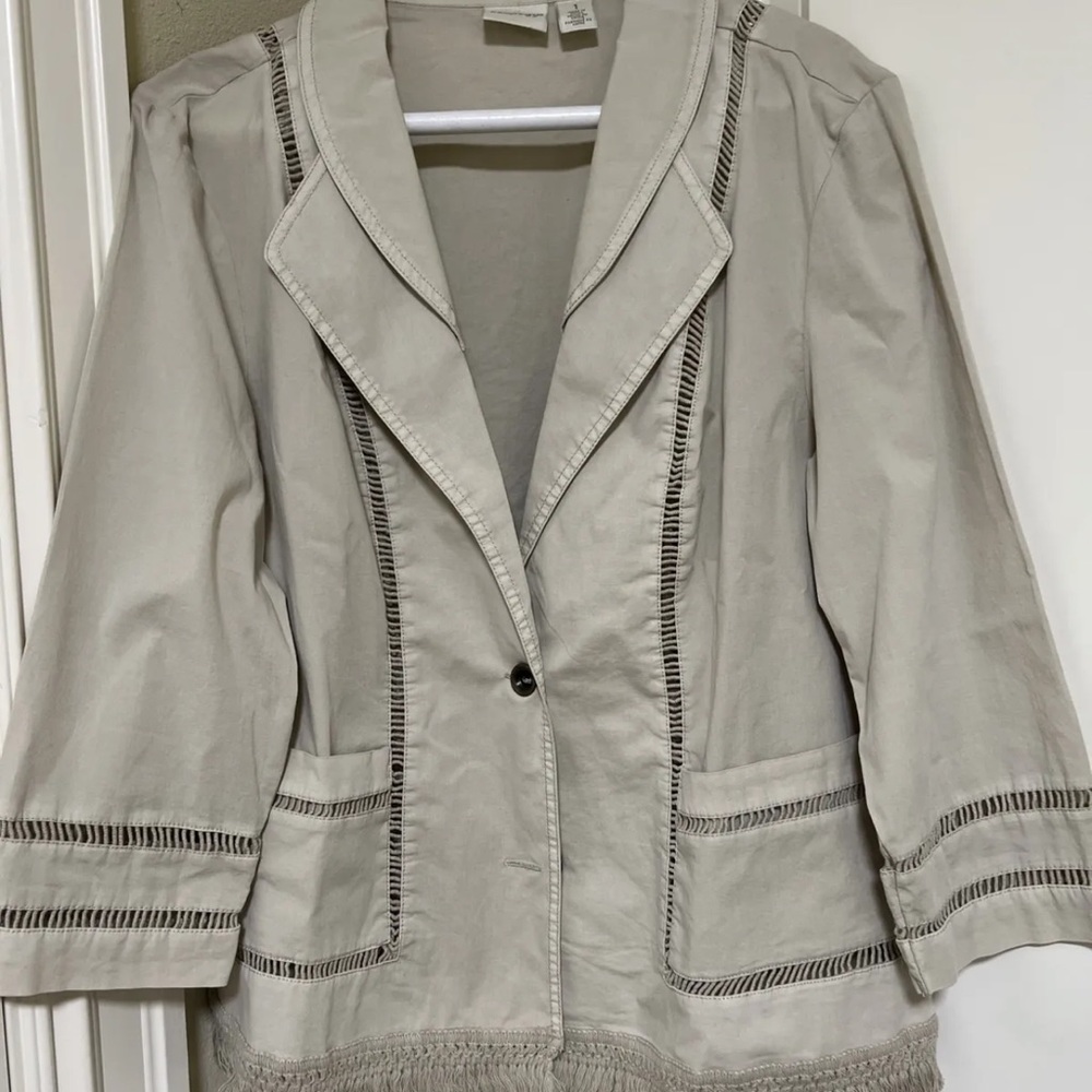 This is a lightweight chico size 1 tan jacket .. it was barely worn